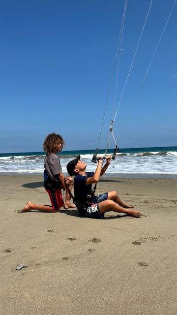 Kids learning to kitesurf