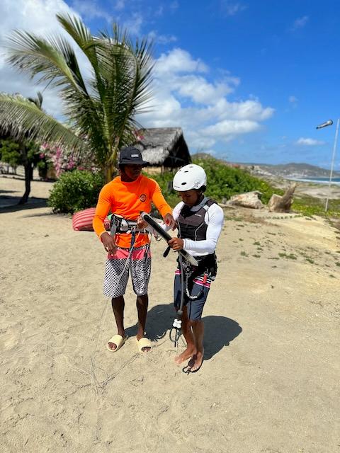 People getting ready for kitesurfing